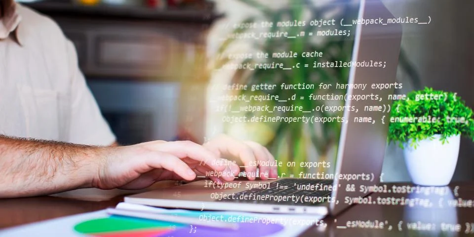 Programmer working with a computer in the office. Close-up of a man's hands.. Stock Photos