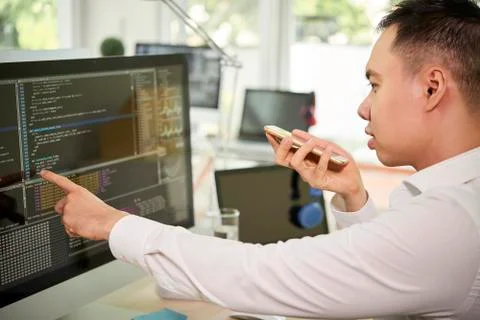 Programmer working on computer at office Stock Photos