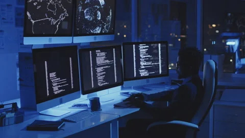Programmer Working in Dark Corporate Office Stock Footage 171064996