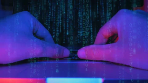 Programmer is working in dark office writing programming code on laptop. Stock Footage 141698549