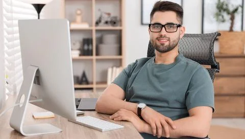 Programmer working at desk in office. Banner design Stock Photos