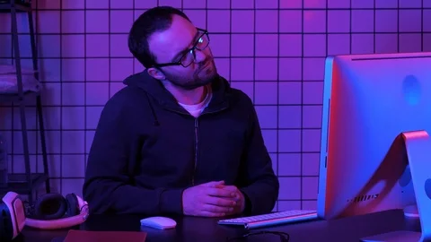 A programmer working on his computer having pain in his neck. Stock Footage 106099331