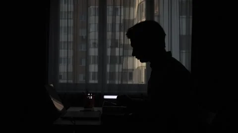 Programmer working from home in dark room with laptop Stock Footage 308407172