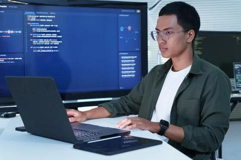 Programmer Working on Laptop with Artificial Intelligence Code Stock-Fotos