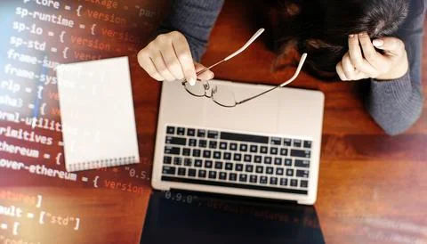 Programmer working on laptop computer and coding code on screen. Internet and Stock Photos