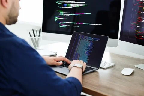 Programmer working with laptop at desk in office, closeup 스톡 사진