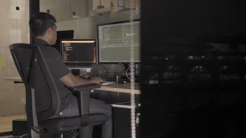 Programmer Working Late in the Office, Coding at his Desk Stock Footage 126458683