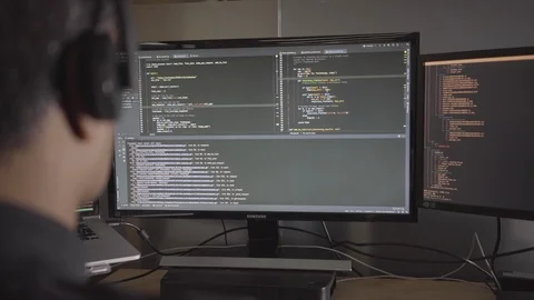Programmer Working Late in the Office, Coding at his Desk Stock Footage 126481471