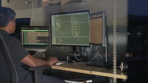 Programmer Working Late in the Office, Coding at his Desk Stock Footage 126499506