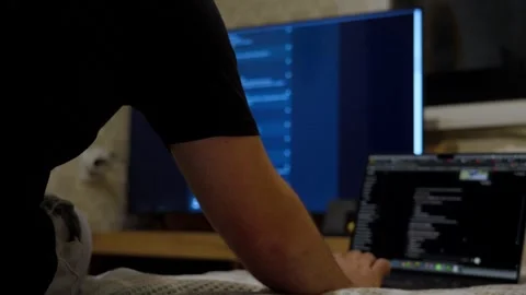 Programmer working with multiple screens in modern workspace Vídeo Stock 341768278
