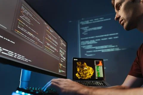 Programmer working on pc programming, writing code for application or website Stockfoto's