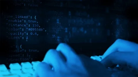 The programmer is working. Quickly prints the code. Keyboard and hands close-up. Stock Footage 81895009