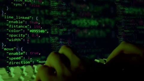 The programmer is working. Quickly prints the code. Keyboard and hands close-up. Stock Footage 81895382