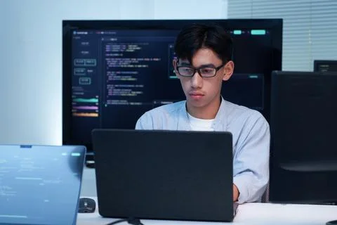 Programmer Working on Software Code with Laptop Foto stock