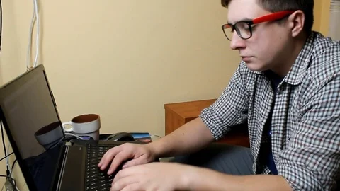 Programmer working in a software developing company office. Programmer solves Stock Footage 81266987