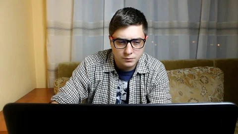 Programmer working in a software developing company office. Programmer solves Vidéo 81266991