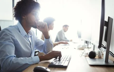 Programmer working in a software developing company office Stock Photos