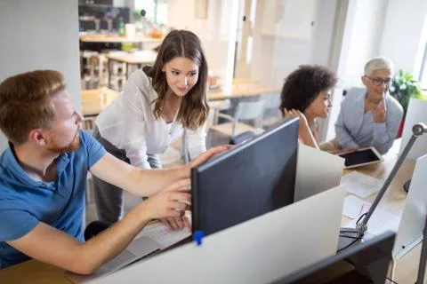 Programmer working in a software developing company office Stock Photos