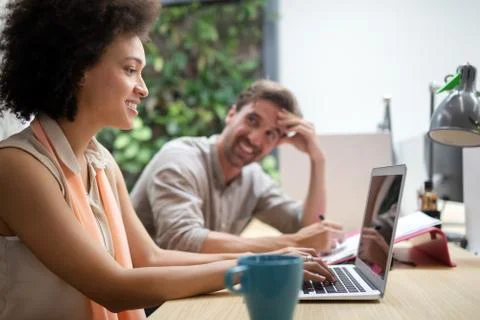 Programmer working in a software developing company office Stock Photos