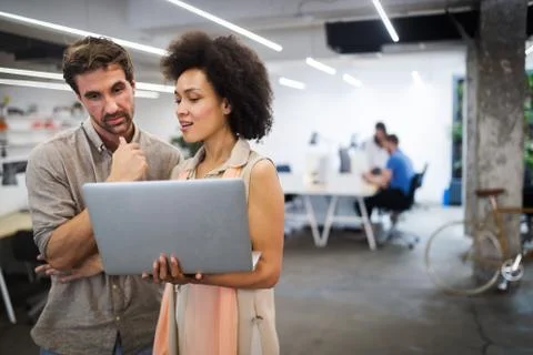 Programmer working in a software developing company office Stock Photos