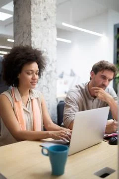 Programmer working in a software developing company office Stock Photos