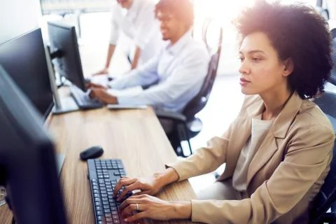 Programmer working in a software developing company office Stock Photos