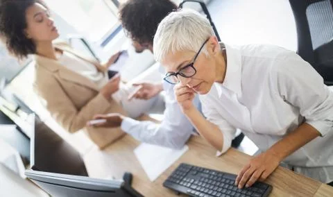 Programmer working in a software developing company office Stock Photos