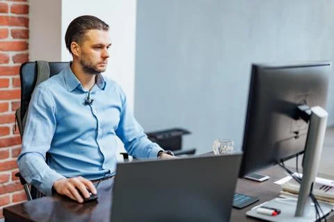 Programmer working in a software development company office. Website design. Stock Photos