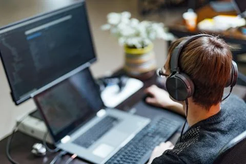 Programmer working in a software development company office. Website design.  Stock Photos