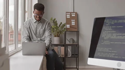 Programmer Working by Window in Office Stock Footage 162265614