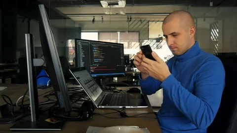 The programmer works at a computer in an empty office during quarantine. Working Stock-Footage 127197359