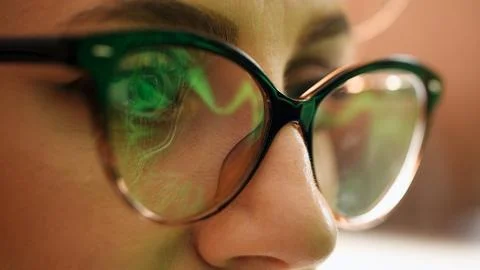 The programmer works at the computer over the program in a dark room. Stock Photos