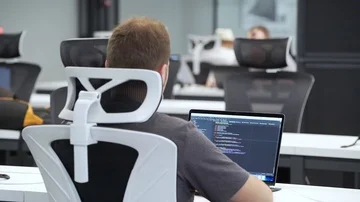Programmer works on laptop in the office Stock Footage 85950359