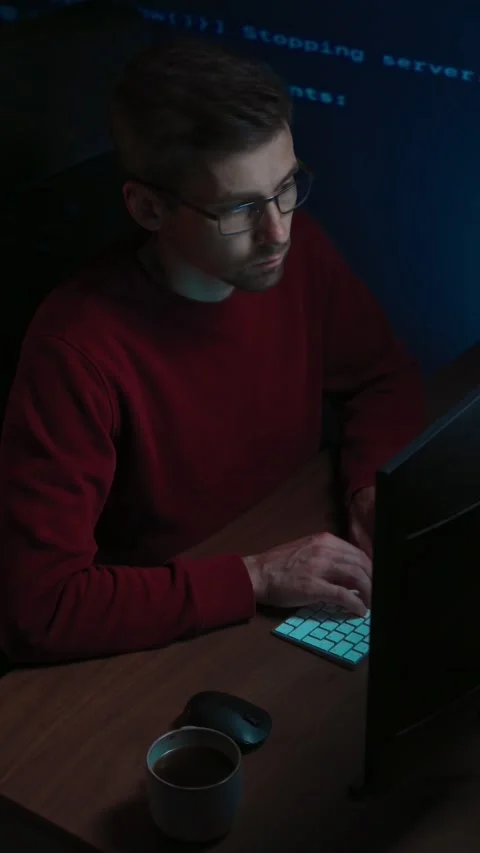 Programmer works late at night on a demanding data science and AI task. Video stock 345446307