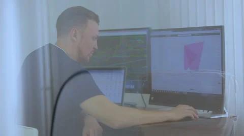 The programmer works at office behind 3 monitors Stock Footage 62519138