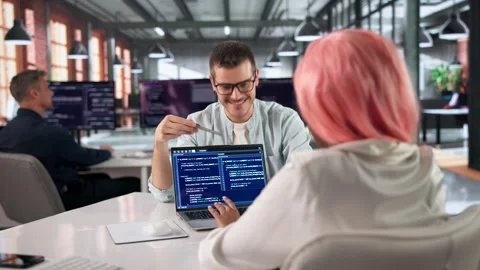 Programmer Writes Clean Code On Computer While Collaborating Video stock 333841476