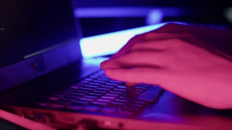 A programmer writes code to crack a program Stock Footage 194774076