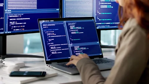 Programmer Writes Code On Desktop Software Stockbeeldmateriaal 335456629