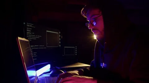 The programmer writes the code for the program Stock Footage 194784591