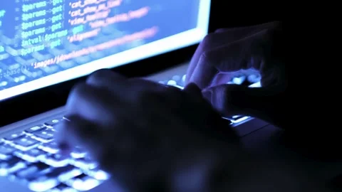 Programmer writes the code software developers working late back view Closeup Stock Footage 334586069
