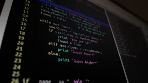 The programmer writes a program code, creating a program, on the screen Video stock 142103277