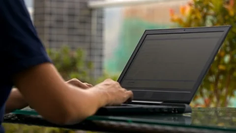 Programmer Writes Program Code Using Laptop on Roof Stock Footage 88068478
