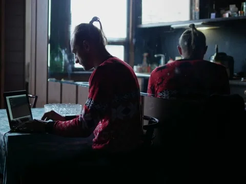 Programmer writing application code on his laptop at home Video stock 222016170