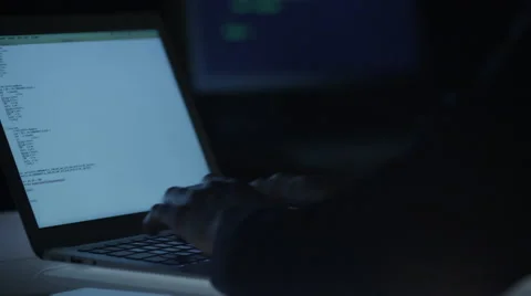 Programmer is Writing Code at Evening on Notebook Video stock 47001274