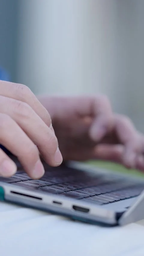 Programmer writing code on laptop keyboard. Vertical Stock Footage 304891618