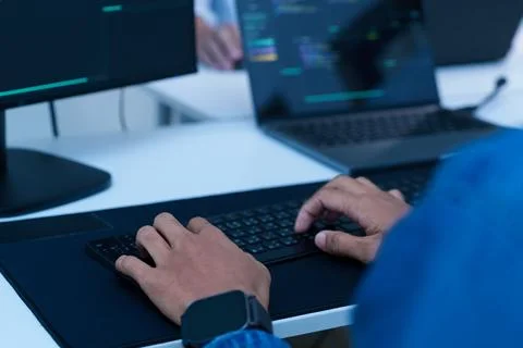 Programmer Writing Code on a Laptop 写真素材