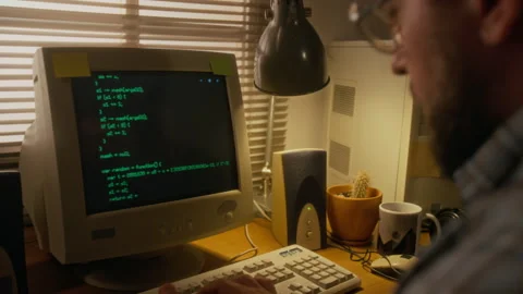 Programmer Writing Code on Retro Computer while Doing Remote Work from Home 库存影片 327236853