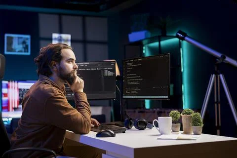 Programmer writing lines of code filtering malicious traffic from cybercriminals Stock Photos