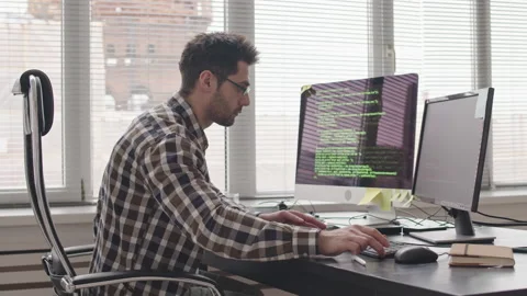 Programmer Writing Program Code on Computer Video stock 165216294