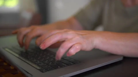 A programmer is writing program code on the laptop. Stock Footage 201569695